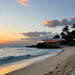 Caribbean Holidays, Barbados September Holidays, The west coast of Barbados at sunset, showing a sandy beach, gentle waves and a waterfront restaurant
