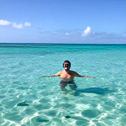 Caribbean Holidays, Barbados Solo Holidays, Solo traveller snorkelling in the calm turquoise sea off the coast of Barbados with tropical fish visible underwater