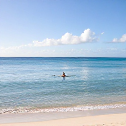 Caribbean Holidays, Barbados Solo Holidays, Sunny February morning at Carlisle Bay, Barbados, with calm clear water, soft sand and a lone swimmer