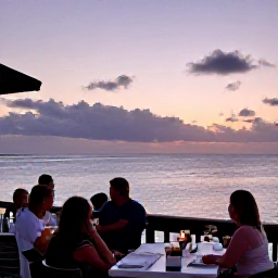 Caribbean Holidays, Bermuda August Holidays, A relaxed Bermuda sunset viewed from a waterfront restaurant, with pastel sky, calm sea and diners enjoying an evening meal