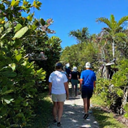 Caribbean Holidays, Bermuda Birdwatching, Friendly birdwatching guide leading visitors along a Bermuda nature trail on a bright August morning