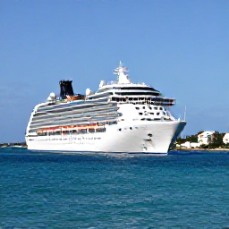 Caribbean Holidays, Bermuda Cruises February, A modern cruise ship sailing towards Bermuda beneath a clear blue sky, with turquoise Atlantic water and the island's pastel buildings visible in the distance