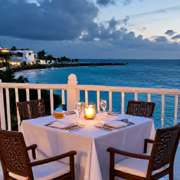 Caribbean Holidays, Bermuda Honeymoons, Elegant Bermuda hotel terrace overlooking the sea, candlelit table prepared for a honeymoon dinner