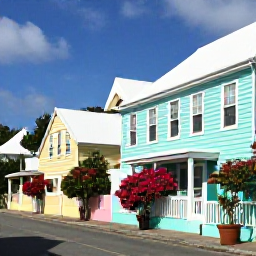 Caribbean Holidays, Bermuda Instagram Spots, Colourful pastel houses and traditional Bermudian architecture along a sunny street in Hamilton, Bermuda, with flowering plants and blue sky