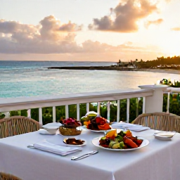 Caribbean Holidays, Bermuda Luxury Holidays, Elegant Bermuda restaurant terrace beside the sea, with fresh seafood dinner and warm evening light