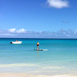 Caribbean Holidays, Bermuda Wellness, Calm Bermuda cove with a paddleboard, small boat and clear blue water under a sunny sky