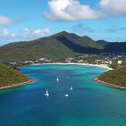 Caribbean Holidays, British Virgin Islands Honeymoons, Aerial view of the British Virgin Islands with turquoise bays, sailing boats, green hills and bright Caribbean sunlight