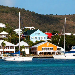 Caribbean Holidays, BVI Cruises May, A colourful waterfront village and harbour on Tortola with sailing boats, palm trees and sunny Caribbean hills