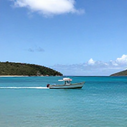 Caribbean Holidays, BVI Fishing March, A small fishing boat cruising across calm turquoise water near Tortola in the British Virgin Islands on a bright March morning