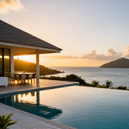 Caribbean Holidays, BVI Luxury Holidays, Elegant luxury villa terrace overlooking a British Virgin Islands bay at sunset in June, private pool and outdoor dining area
