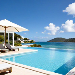 Caribbean Holidays, BVI Luxury May, Elegant beachfront luxury villa with an infinity pool overlooking a calm Caribbean bay in the British Virgin Islands