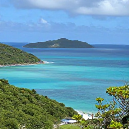 Caribbean Holidays, BVI Nature Holidays, A bright March morning overlooking turquoise sea, green hills and rocky islands in the British Virgin Islands