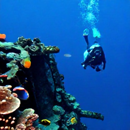 Caribbean Holidays, BVI Scuba Diving, A scuba diver swimming over the RMS Rhone shipwreck with coral, fish and blue Caribbean water