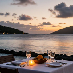Caribbean Holidays, BVI Spa Breaks, A sunset dinner at a waterfront restaurant in the British Virgin Islands, with Caribbean dishes, candlelight and calm sea beyond