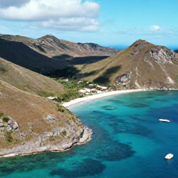 Caribbean Holidays, Caribbean Adventure Holidays, Aerial view of Saint Martin and Sint Maarten coastline with turquoise water, rugged hills and small boats