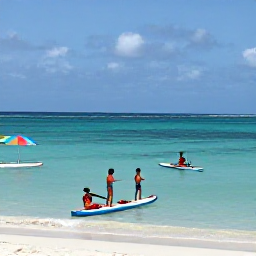 Caribbean Holidays, Caribbean Holidays, Family enjoying calm Caribbean sea and sandy beach in April, with paddleboards and colourful beach umbrellas