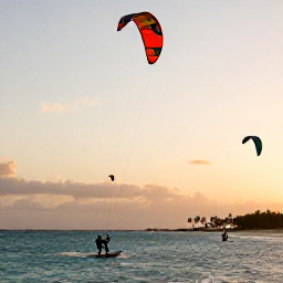 Caribbean Holidays, Caribbean Kitesurfing, Kitesurfers enjoying a breezy Caribbean lagoon at sunset, with colourful kites in the sky and distant palms