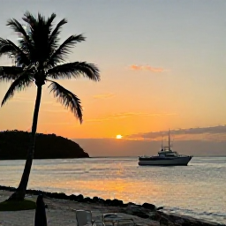 Caribbean Holidays, Caribbean Scuba Diving, Caribbean harbour at sunset with a dive boat returning from the sea, palm-lined shore, relaxed island atmosphere and warm evening light