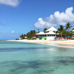Caribbean Holidays, Caribbean Travel Companies, A peaceful Caribbean shoreline with clear water, colourful beach umbrellas and a welcoming boutique hotel