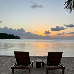Caribbean Holidays, Caribbean Wellness, A tranquil Caribbean sunset over a calm bay, with two comfortable loungers and a peaceful holiday atmosphere