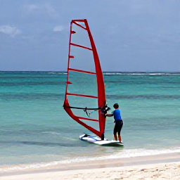 Caribbean Holidays, Caribbean Windsurfing, Friendly windsurfing instructor helping a beginner on a stable board in shallow, calm Caribbean sea near a sandy beach