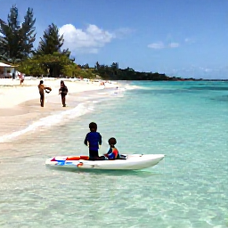 Caribbean Holidays, Cayman Family Holidays, Children paddling in shallow clear water while parents relax on Seven Mile Beach, Grand Cayman