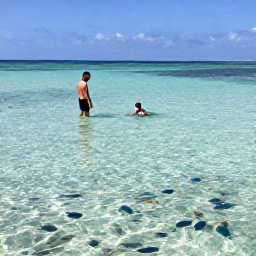 Caribbean Holidays, Cayman Family Holidays, Children snorkelling in shallow clear water with a parent near a calm Cayman Islands beach, colourful fish visible below