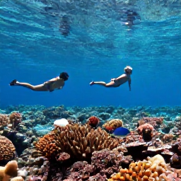 Caribbean Holidays, Cayman Islands April, Snorkellers viewing colourful coral and tropical fish in clear Cayman Islands water near a shallow reef