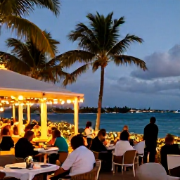 Caribbean Holidays, Cayman Islands December, Festive evening in Grand Cayman with palm-lined waterfront, warm lights, outdoor dining and visitors enjoying a relaxed Christmas atmosphere