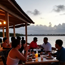 Caribbean Holidays, Cayman Islands Holidays, A relaxed waterfront restaurant in George Town, Grand Cayman, with diners enjoying fresh seafood at sunset