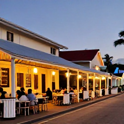 Caribbean Holidays, Cayman Islands November, An evening street scene in George Town, Grand Cayman, with local restaurants, relaxed visitors and warm Caribbean light