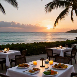 Caribbean Holidays, Cayman Islands October, A relaxed evening at a Cayman Islands beach restaurant, with outdoor tables, local food and a glowing sunset over the sea