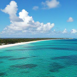 Caribbean Holidays, Cayman Islands Tours, Aerial view of Grand Cayman coastline in September, with clear turquoise water, white sandy beaches and scattered tropical clouds