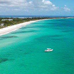 Caribbean Holidays, Cayman January Escapes, Aerial view of Grand Cayman with bright turquoise water, white sand beaches and a small boat offshore