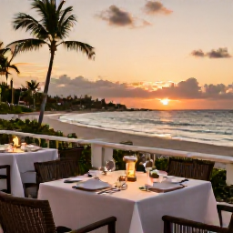 Caribbean Holidays, Cayman Luxury April, Fine dining terrace overlooking Seven Mile Beach in Grand Cayman at sunset, elegant table setting and tropical coastline
