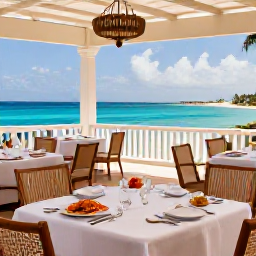 Caribbean Holidays, Cayman Luxury November, Elegant Cayman Islands restaurant serving fresh seafood on an outdoor terrace overlooking the sea