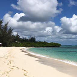 Caribbean Holidays, Cayman Nature Holidays, Quiet sandy beach and mangrove-lined shoreline on Little Cayman beneath a partly cloudy July sky