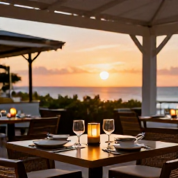 Caribbean Holidays, Cayman Spa Breaks, Outdoor dining at a stylish Grand Cayman restaurant at sunset, with Caribbean dishes and a relaxed island atmosphere