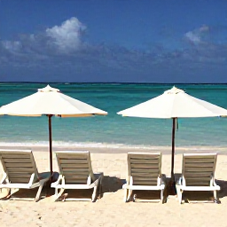 Caribbean Holidays, Cheap Aruba March, Aruba beach with sun loungers, calm clear sea and budget-conscious travellers enjoying a March holiday