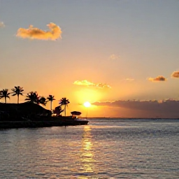 Caribbean Holidays, Cheap Bahamas February, Golden sunset over Nassau harbour in The Bahamas, with palm silhouettes, calm water and warm evening light