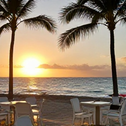 Caribbean Holidays, Cheap Bahamas Holidays, Friendly Bahamas beach caf&eacute; at sunset in September, with outdoor tables, palm trees and warm golden light over the sea
