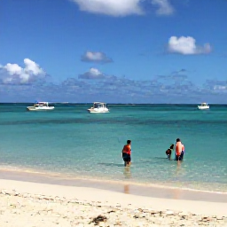 Caribbean Holidays, Cheap Bahamas Holidays, Visitors enjoying a quiet sandy beach near Nassau, with clear shallow water, bright skies and small boats offshore