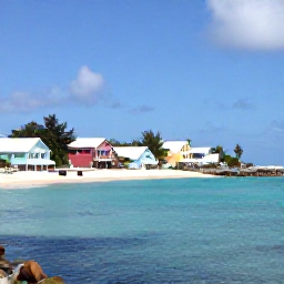 Caribbean Holidays, Cheap Bermuda Holidays, A bright coastal view of Bermuda with pastel houses, turquoise water and a sandy beach