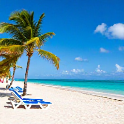 Caribbean Holidays, Cheap Cuba Holidays, Wide white sandy beach in Varadero with clear blue sea, sun loungers and palm trees under a bright sky