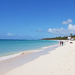 Caribbean Holidays, Cheap Cura&ccedil;ao June, Sunny Cura&ccedil;ao beach in June with calm turquoise water, white sand and a few relaxed travellers