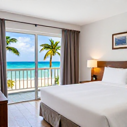 Caribbean Holidays, Cheap December Antigua, A simple budget-friendly Caribbean hotel room near an Antigua beach, with bright natural light, clean furnishings and a balcony overlooking palm trees