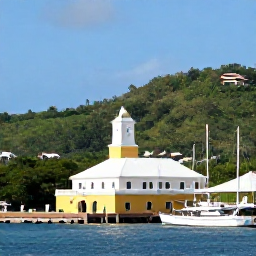 Caribbean Holidays, Cheap December Antigua, Historic Nelson's Dockyard in Antigua on a sunny day, showing restored colonial buildings, sailing boats and green hills in the background