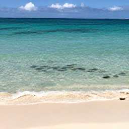 Caribbean Holidays, Cheap December Holidays, A calm stretch of Grace Bay Beach with crystal-clear water, snorkellers and colourful tropical fish visible near the shore