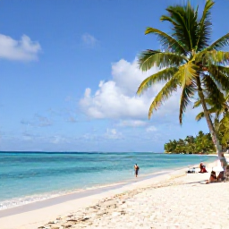 Caribbean Holidays, Cheap February Guadeloupe, Sunlit Grande-Terre beach in Guadeloupe with turquoise water, palm trees and a few relaxed holidaymakers