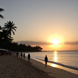 Caribbean Holidays, Cheap Jamaica April, Jamaican sunset over a sandy beach with travellers walking beside the sea and warm evening light